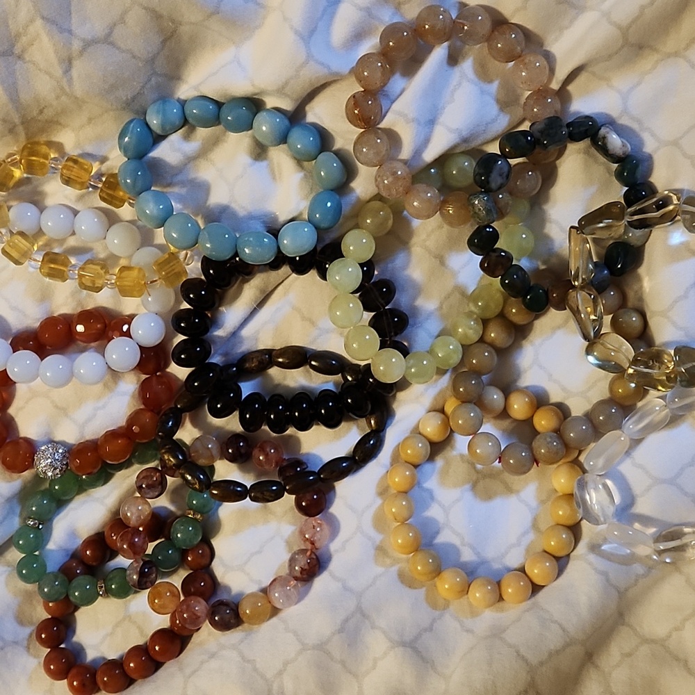 12mm and higher bracelets. Various kinds Jade, golden prenite, garden quartz etc